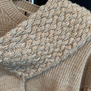 Waist length sweater with detailed sleeves